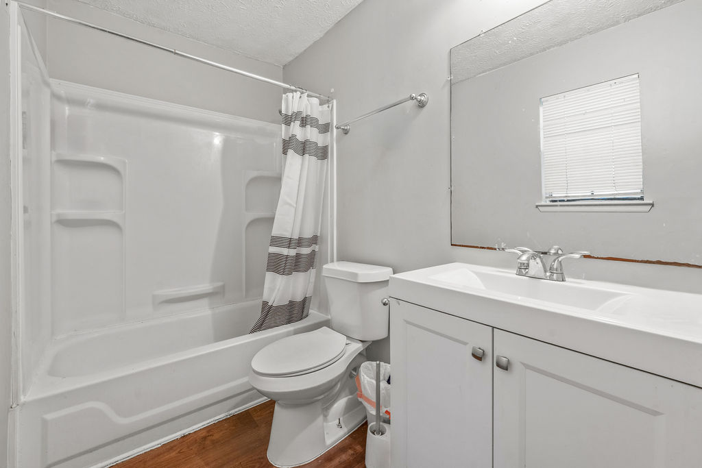 Updated full bathroom with tub-shower and vanity