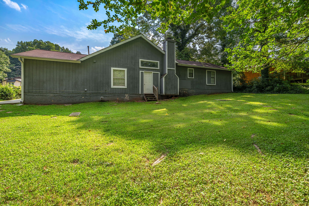 Rear exterior of home with back entry